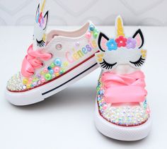 How adorable are these unicorn inspired converse! The perfect shoe to complete the look!Please leave your name needed in the notebox during checkoutVisit the tutu section or search bar for the matching outfit!If you are unsure of sizing please scroll to the last photos for our size charts, or visit our size charts here--> https://pinktoesnhairbows.com/pages/size-chartAll sales are FINAL, Ship dates can be found directly on the listing, please view our policies in detail here---> https://pinktoes Unicorn Shoes, Overalls Boys, Tutu Dress Costumes, Bling Converse, Unicorn Outfit, Pink Toes, Unicorn Dress, Girls Overalls, Girls Converse