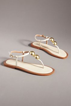 Leather upper, insole, sole Buckle styling Imported | T-Strap Thong Sandals by Vicenza in Beige, Women's, Size: 37, Leather at Anthropologie Elegant T-strap Sandals For Vacation, Elegant Adjustable T-strap Sandals With Single Toe Strap, Elegant Adjustable T-strap Sandals, Elegant Adjustable T-strap Toe Post Sandals, Elegant Adjustable T-strap Sandals With Toe Post, Elegant T-strap Toe Post Sandals For Vacation, Thong Sandals, T Strap, Leather Upper