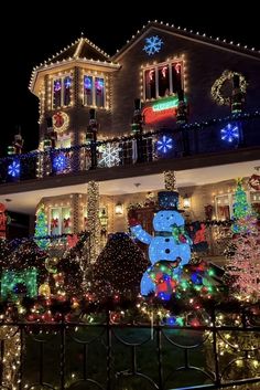 a house covered in christmas lights and decorations