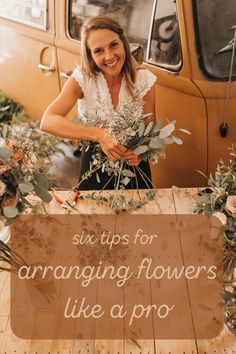 a woman standing next to a sign that says six tips for arranging flowers like a pro