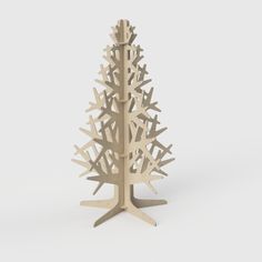 a wooden christmas tree is shown on a white background with the base cut out to look like it's made from wood