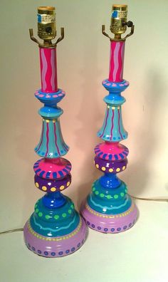 two colorful candlesticks are sitting next to each other