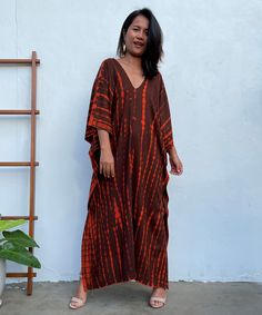 MALA handworks Mala Kaftan in Earthy Red and Umber Brown Tie Dye Red Batik Print Kaftan For Summer, Summer Red Batik Print Kaftan, Festival Tie Dye Kaftan With Batik Print, Summer Vacation Tie-dye Kaftan, Spring Casual Tie-dye Kaftan, Hand-dyed Tie-dye Kaftan For Beach, Festival Tie-dye Maxi Kaftan, Bohemian Tie-dye V-neck Kaftan, Brown Tie