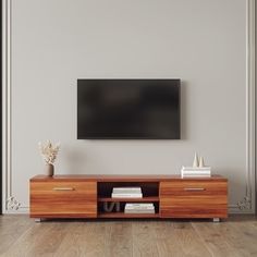 an entertainment center with a flat screen tv mounted on the wall