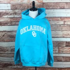 University Of Oklahoma Sooners Teal Blue Hoodie Sweatshirt With Kangaroo Pouch. Brand: Champion Size: Youth Medium, 7-8 Year Old. 50/50 Cotton/Polyester Blend. Soft Inner Fleece Lining. Light Blue Long Sleeve Hoodie With Letter Print, Light Blue Hooded Sweatshirt With Letter Print, Blue Cotton Top With Kangaroo Pocket, Light Blue Hoodie With Letter Print For Winter, Light Blue Letter Print Winter Hoodie, Blue Hooded Hoodie For School, Winter School Blue Hoodie, Winter Light Blue Hoodie With Letter Print, Blue Fleece Tops With Letter Print