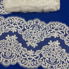 Experience a level of couture luxury that was once only reserved for royalty with our exquisite Corded Double Sided Lace Trimming Embroidered on 100% Polyester Net Mesh. This elegant trimmings is delicately crafted with handmade embroidery, creating an air of sophistication perfect for any special occasion. Perfect to pair with a bridal gown or dance costume, or use as an extra layer of embellishment to a gorgeous evening dress or quinceanera gown. With styles ranging from classic to modern and Elegant Embroidered White Lace, Elegant Off-white Fabric With Floral Embroidery, Elegant Off-white Embroidered Fabric With Floral Design, Cream Embroidered Lace For Ceremony, Elegant White Lace With Intricate Embroidery, Ceremony Embroidered Cream Lace, White Lace For Formal Occasions, White Lace With Lace Work For Formal Occasions, Elegant White Lace With Pearl Embroidery