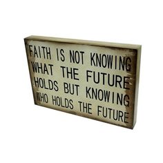 a sign that says, faith is not known what the future holds but know who holds the future