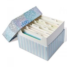 a blue and white striped file box filled with files