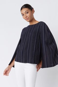 We took the concept from our best selling Cape Sweatshirt and made it into a new style just for you. Made in our variegated stripe gauze, this is sure to be your next favorite style. Pair it with any light color denim or trouser for an all year round look.THIS ITEM IS FINAL SALE. Boatneck shape with facing, cape back detail with longer length, clean hem finish. - 65% Polyester, 34% Viscose, 1% Spandex - Made in NYC - Professional dry clean or machine wash - Our model is 5'9" wearing size S - Che Chic Cotton Top With Horizontal Stripes, Chic Cotton Tops With Striped Sleeves, Chic Relaxed Fit Tops With Vertical Stripes, Modern Striped Relaxed Fit Top, Modern Striped Tops With Relaxed Fit, Blue Yarn-dyed Relaxed Fit Tops, Blue Yarn-dyed Tops With Relaxed Fit, Chic Pinstripe Cotton Tops, Modern Striped Cotton Tops