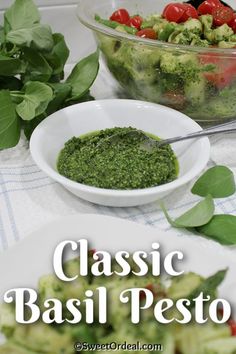 basil pest in a white bowl next to a plate of pasta and vegetables with the title classic basil pest