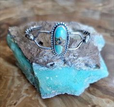 Vintage anglo/artisan sterling and turquoise bracelet. This is a really interesting delicate design and is for the small wrist at a size 6.25 but does have some flex to it. I have had no luck matching the signature, but this unusual design did take some talent and is well done.   Shipping and insurance is free via USPS priority mail.  Please see all pictures as I have tried to supply detailed images,all sales are final so please ask any questions prior to purchasing. Adjustable Oval Turquoise Sterling Silver Bracelet, Wedding Jewelry Bracelets, Delicate Design, Unusual Design, Well Done, Wedding Bracelet, Detailed Image, All Pictures, Priority Mail