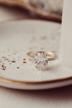 a close up of a ring on top of a plate with dirt all over it