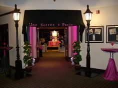 the entrance to une soiree de paris is decorated with pink and black decorations