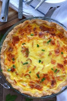 a cheesy quiche in a glass pie dish