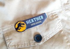 there is a sticker on the back of a jacket that says,'leather dino adventure '