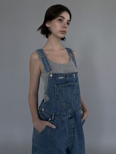 Editor's Notes The denim jumpsuit is made with washed denim with a medium denim color with a wide fit. - Pockets on the front to make it easy to store items- Style variously by wearing different tops- Perfect to wear dailyMeasurements(in.)ONE SIZE- Length: 54.33 in. - Waist: 17.32 in. - Shoulder: 9.84 in. - Hips: 21.26 in. - Thigh: 12.6 in. - Hem: 9.06 in.*The sizes may be vary by ±0.39-0.79 in. depending on the method and location of measuring*The exact color may vary depending on the screen resolutionModel info: Olena - Height 5' 8'', 112 lbs, Top 44, Bottom 27, Shoes KR 250mmComposition & Care- 100% Cotton- Dry cleaning recommended for the first wash- If washing later, wash in lukewarm water- Store jackets in a cloth hanger- Fold the sweaters to store- Due to the natu Utility Style Medium Wash Denim Overall Jumpsuit, Washed Denim Shortalls, Utility Medium Wash Denim Overall Jumpsuit, Utility Medium Wash Denim Overalls, Utility Denim Overalls In Washed Blue, Utility Style Medium Wash Overalls, Washed Blue Denim Utility Overalls, Washed Denim Blue Shortalls, Medium Wash Denim Overall Dress With Pockets