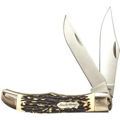 a knife that has some sort of animal print on the blade and is open to show it's blades