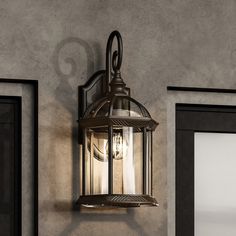 an outdoor light hanging on the side of a wall next to a doorway and door