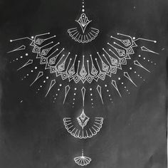 a black and white photo of a clock on a chalkboard