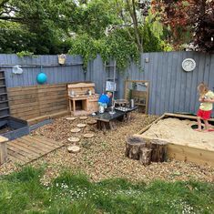 a child is playing in the sandbox