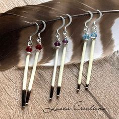 Porcupine Quill earrings with your choice of birthstone-colored bicone crystal beads + Silver Accent Beads. With Sterling Silver ear wire hooks.  very lightweight! approximate measures from top of hook to bottom of quill: 2 inches color/month options:    #1: January/Garnet    #2: February/Amethyst    #3: March/Aquamarine  Please Note to best preserve your piece please use care when handling + storing your jewelry  (note that these are only birthstone-colored crystals. this listing is not for rea Aboriginal Craft, Quill Jewelry, Homemade Jewellery, Birthstone Crystals, Bullet Earrings, Stitch Jewelry