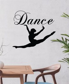 a wall decal with the word dance on it and a silhouette of a ballerina