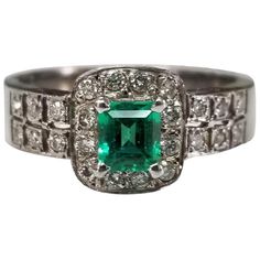 14k white gold emerald and diamond ring, containing 1 emerald cut emerald weighing .38cts. and 26 round full cut diamonds of very fine quality weighing .30pts. Stunning Diamond Rings, Opal Diamond Ring, Emerald And Diamond Ring, Emerald Diamond Ring, Contemporary Ring, Diamond Ring Settings, Diamond Cocktail Rings, Emerald Diamond, Opal Jewelry