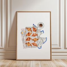 there is a framed picture with croissants on it