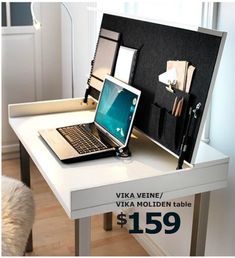 an open laptop computer sitting on top of a white desk