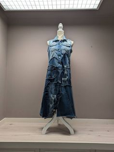 a denim dress on display in a room