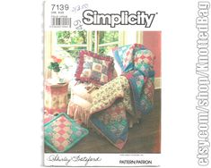 an image of a magazine cover with quilts and pillows on the front, and a chair in the background