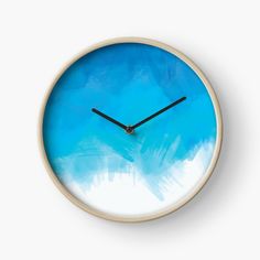 a clock with blue and white paint on it