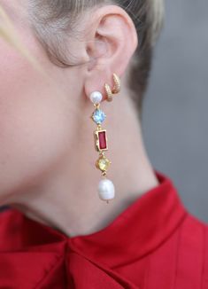 Adorned with vibrant gemstones and lustrous freshwater pearls, these earrings are made to shine. Our long drop earrings blend rich hues of varying colors into a harmonious look that add a pop of glam to any outfit. Each stone and pearl contribute to a piece that is as unique as it is sophisticated. Transition from daytime chic to evening glitz with ease in these gold-filled beauties! Size: 2.75 inch drops Bold Jewelry, Long Drop Earrings, Pearl Gemstone, Gold Filled Jewelry, To Shine, Pearl Drop, Simple Outfits, Freshwater Pearls, Gold Filled