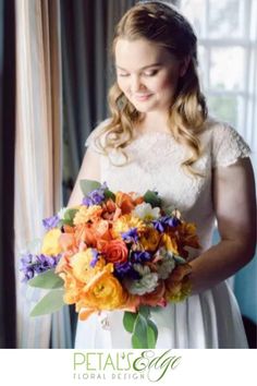 a woman in a white dress holding a bouquet of orange and purple flowers with the words petal & co floral designs