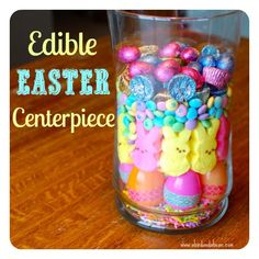 an easter centerpiece in a glass on a table with the words edible easter centerpiece