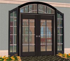 an image of a black double doors in front of a building with flowers on the ground