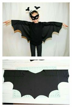 a child wearing a bat costume made out of paper and cut outs to make it look like