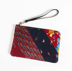 a small zippered pouch with cartoon characters on it