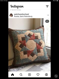 a pillow that is sitting on top of a window sill next to a window