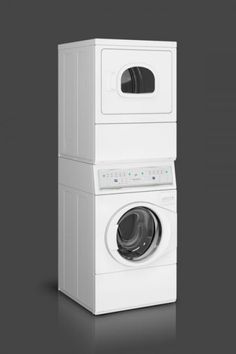 two stacked washers and a dryer on a black background, one is white