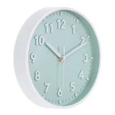 a green and white clock with numbers on the face is shown against a white background