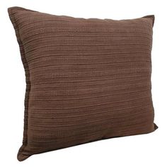 a brown pillow on a white background