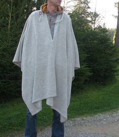 Men's knitted poncho oversized knit poncho blanket for men Knit Wrap Cape gift for mens Shawl for travel scarf-palantine unisex Elf - Shawl Stylish knitted poncho A casual drape and oversized shape lend versatile styling options to a softly knit wrap cape. Wrap it around the shoulder or just toss it over what you're wearing when you want an extra shield of comfort from cool air. Made from 65% Peruvian Highland wool and 35% superfine alpaca, and available in 21 beautiful shades, DROPS Flora is a Oversized Cozy Poncho For Outdoor, Mens Shawl, Poncho Blanket, Hand Knit Poncho, Alpaca Shawl, Alpaca Poncho, Cape Wrap, Travel Scarf, Knit Poncho