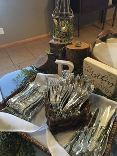 silverware is sitting in a basket on a table