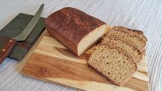 sliced loaf of bread and knife on cutting board