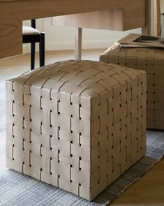 two foot stools sitting next to each other on top of a carpeted floor