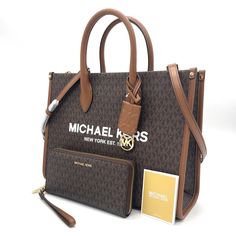 Brand New With Tag Michael Kors Mirella Medium Ew Tote Bag Color: Brown Product Details About This Item Fabric Type 100 % Polyester Origin Imported About This Item Gold-Tone Hardware 15.75”W X 14”H X 7.75”D Handle Drop: 5.25” Adjustable Strap: 20.5”-24.25” Interior Details: Back Zip Pocket, 2 Front Slip Pockets Lining: 100% Polyester Description Details Tote Bag Logo Pvc Leather Gold-Tone Hardware 15.75”W X 14”H X 7.75”D Handle Drop: 5.25” Adjustable Strap: 20.5”-24.25” Interior Details: Back Zi Designer Wallet With Removable Pouch, Michael Kors Luxury Wallets For Everyday Use, Luxury Michael Kors Wallet For Everyday, Luxury Michael Kors Wallets For Everyday, Michael Kors Wallets With Removable Pouch For Daily Use, Michael Kors Luxury Travel Wallets, Luxury Travel Wallets By Michael Kors, Luxury Michael Kors Travel Wallets, Luxury Michael Kors Wallet