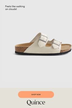 The next best thing to walking on clouds, our Nappa Leather Double Buckle Slide are crafted with supple full-grain leather and feature an ultra-cushiony yet supportive footbed designed to hug the soles of your feet. And with a lightweight cork and EVA bottom, you’ll feel light as air with each step.  | Quince | Women's Nappa Leather Double Buckle Slide in White, Size 5 Suede Slides, Boyfriend Cardigan, On Clouds, Walking On Clouds, Performance Leggings, Scoop Neck Tee, Slide In, Nappa Leather, Free Bag