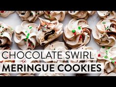 chocolate swirl meringue cookies with green sprinkles on top and white background