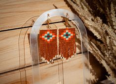 Looking for the perfect boho earrings to make a statement? Look no further than these gorgeous handmade beaded fringe earrings! These boho-inspired earrings feature colorful beads and delicate fringe, making them the perfect accessory to complete your boho look. Whether you're looking for something to wear for a special occasion or just want to add some colorful flair to your everyday style, these statement earrings are sure to turn heads wherever you go. So why wait? Add these stunning beaded f Bohemian Adjustable Tassel Earrings With Fringe, Adjustable Bohemian Tassel Earrings With Fringe, Bohemian Brown Tassel Earrings, Brown Bohemian Tassel Earrings, Southwestern Beaded Earrings With Tassels For Festival, Bohemian Brown Fringe Earrings, Southwestern Fringe Beaded Earrings As Gift, Southwestern Beaded Fringe Earrings As Gift, Southwestern Fringe Beaded Earrings For Gift